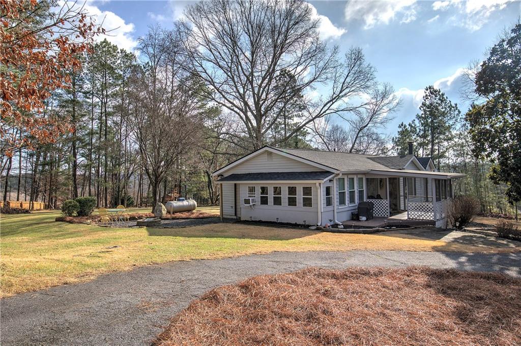 2023 Fate Conn Road Canton, GA 30114 - Photo 26 of 59 a view of a house with swimming pool and sitting area