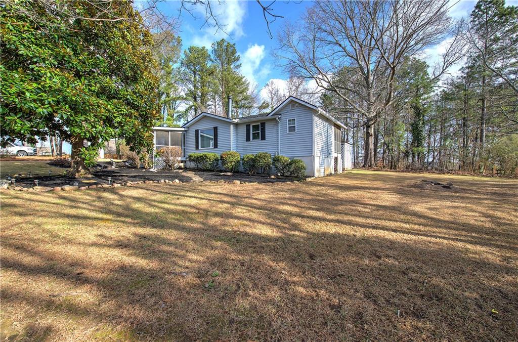 2023 Fate Conn Road Canton, GA 30114 - Photo 28 of 59 a front view of a house with a yard