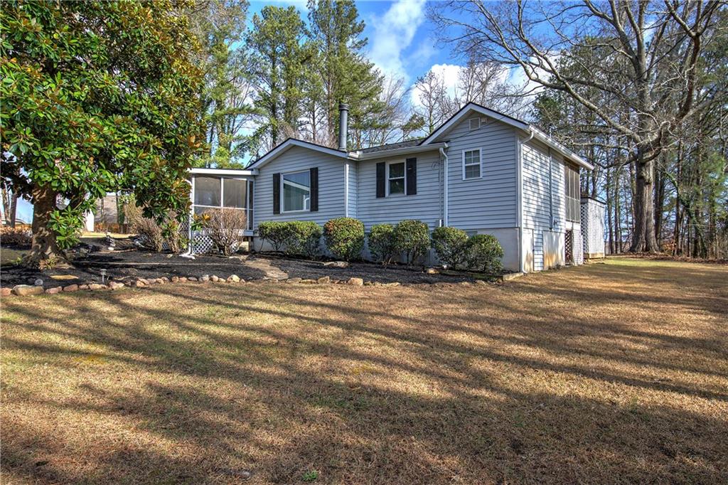 2023 Fate Conn Road Canton, GA 30114 - Photo 29 of 59 a front view of a house with a yard
