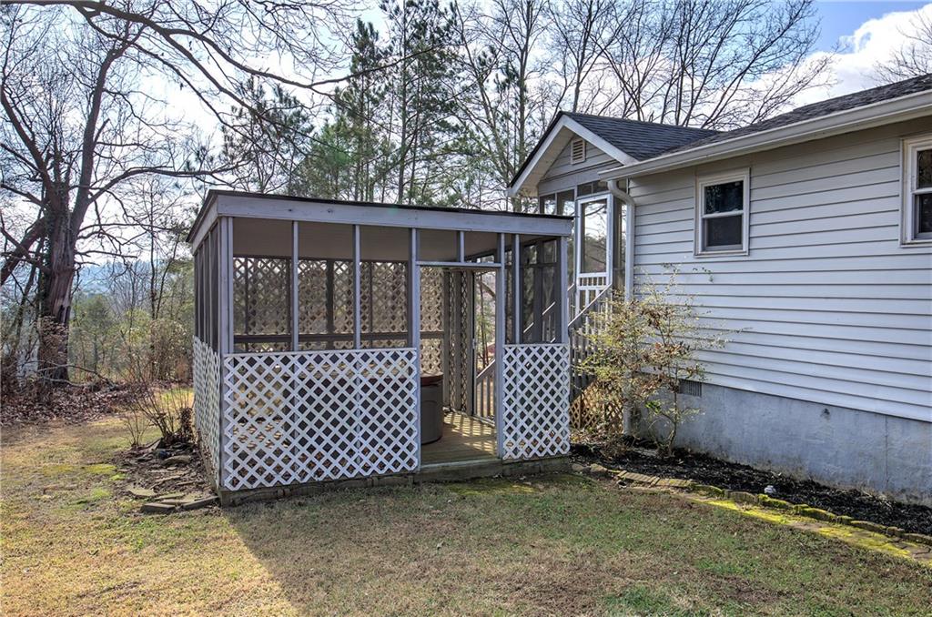 2023 Fate Conn Road Canton, GA 30114 - Photo 36 of 59 a view of a house with a yard and a large tree