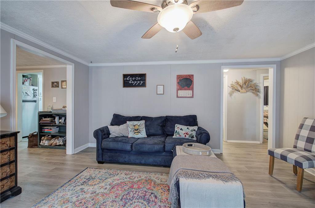 2023 Fate Conn Road Canton, GA 30114 - Photo 4 of 59 a living room with furniture and wooden floor
