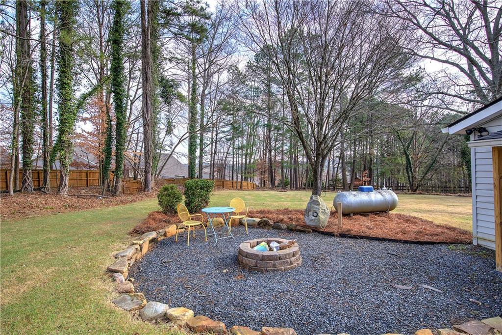2023 Fate Conn Road Canton, GA 30114 - Photo 41 of 59 a view of a backyard with plants and tree