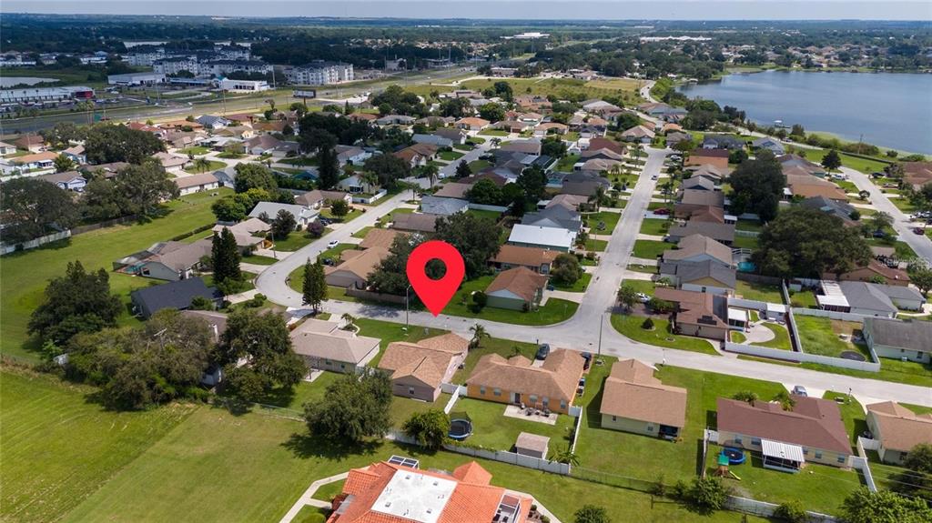 871 Reflections Loop East Winter Haven, FL 33884 - Photo 21 of 23 an aerial view of residential houses with outdoor space and lake view