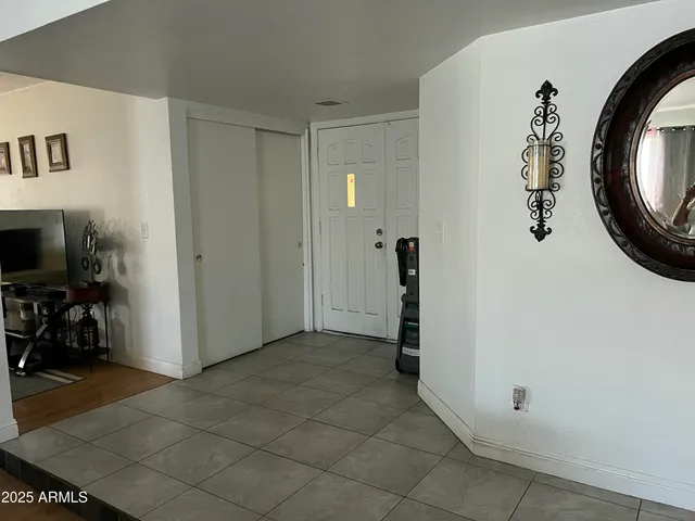 swimming pool view with a seating space