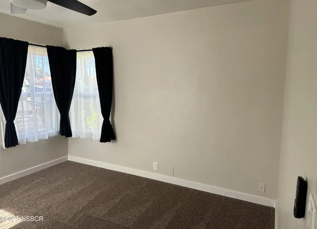 a view of entry way with wooden floor and windows