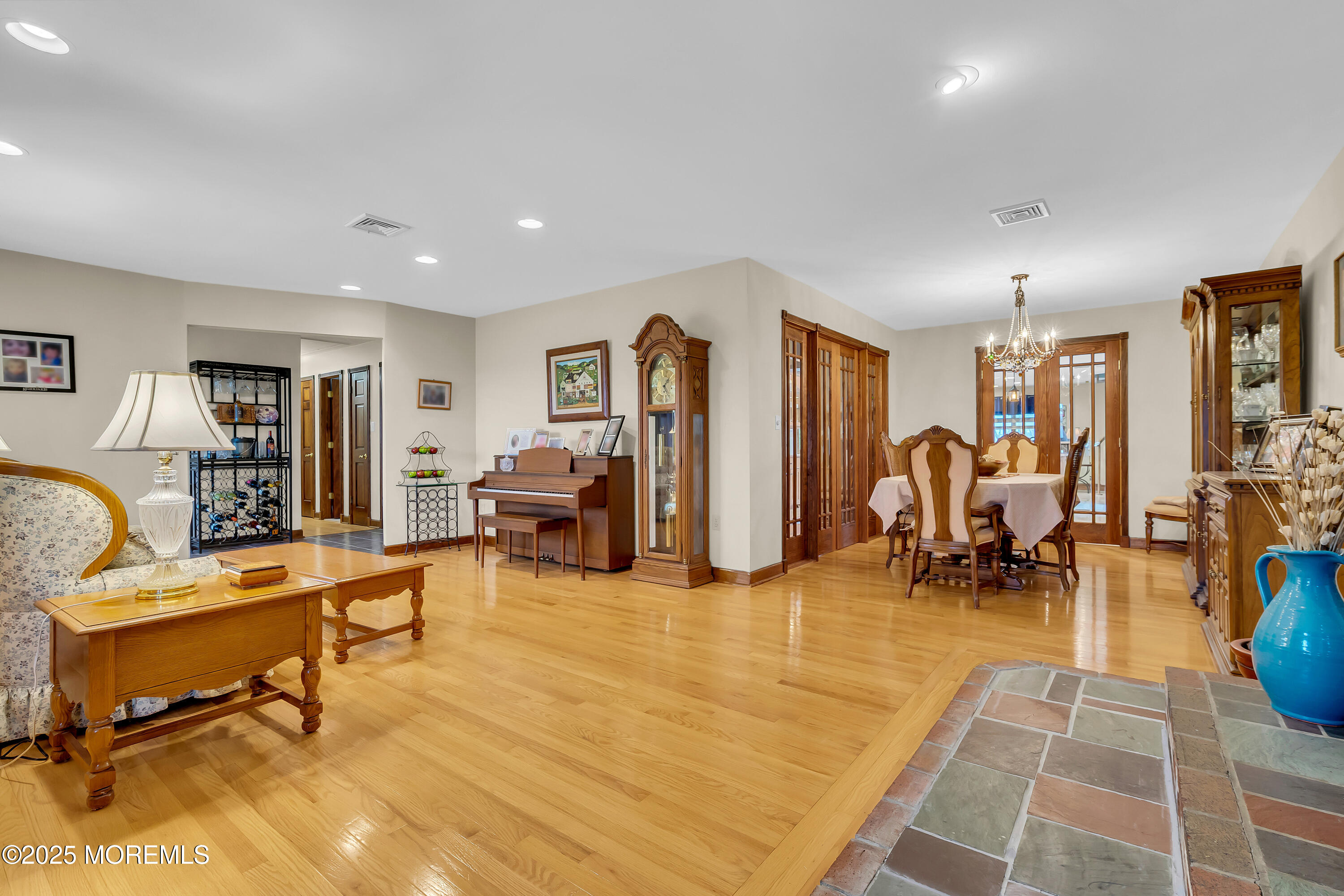 49 Highbridge Road New Egypt, NJ 08533 - Photo 12 of 44 a living room with furniture and a dining table with rug floor
