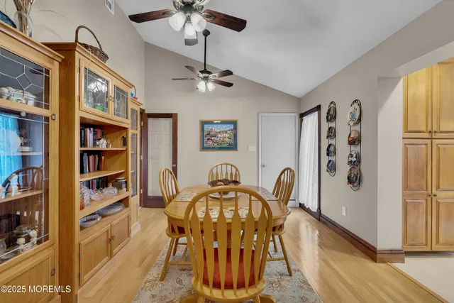 a view of a dining room with furniture and a window