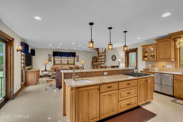 a kitchen with counter top space appliances and cabinets