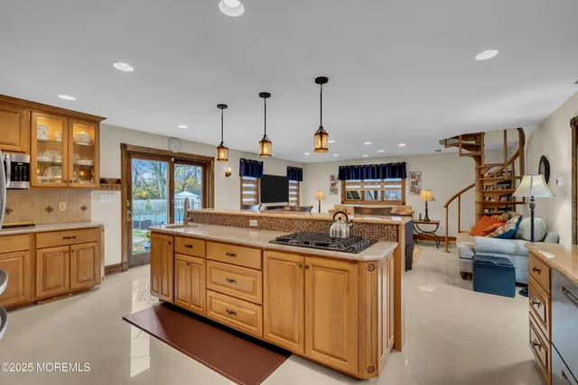a kitchen with stainless steel appliances granite countertop a sink and cabinets