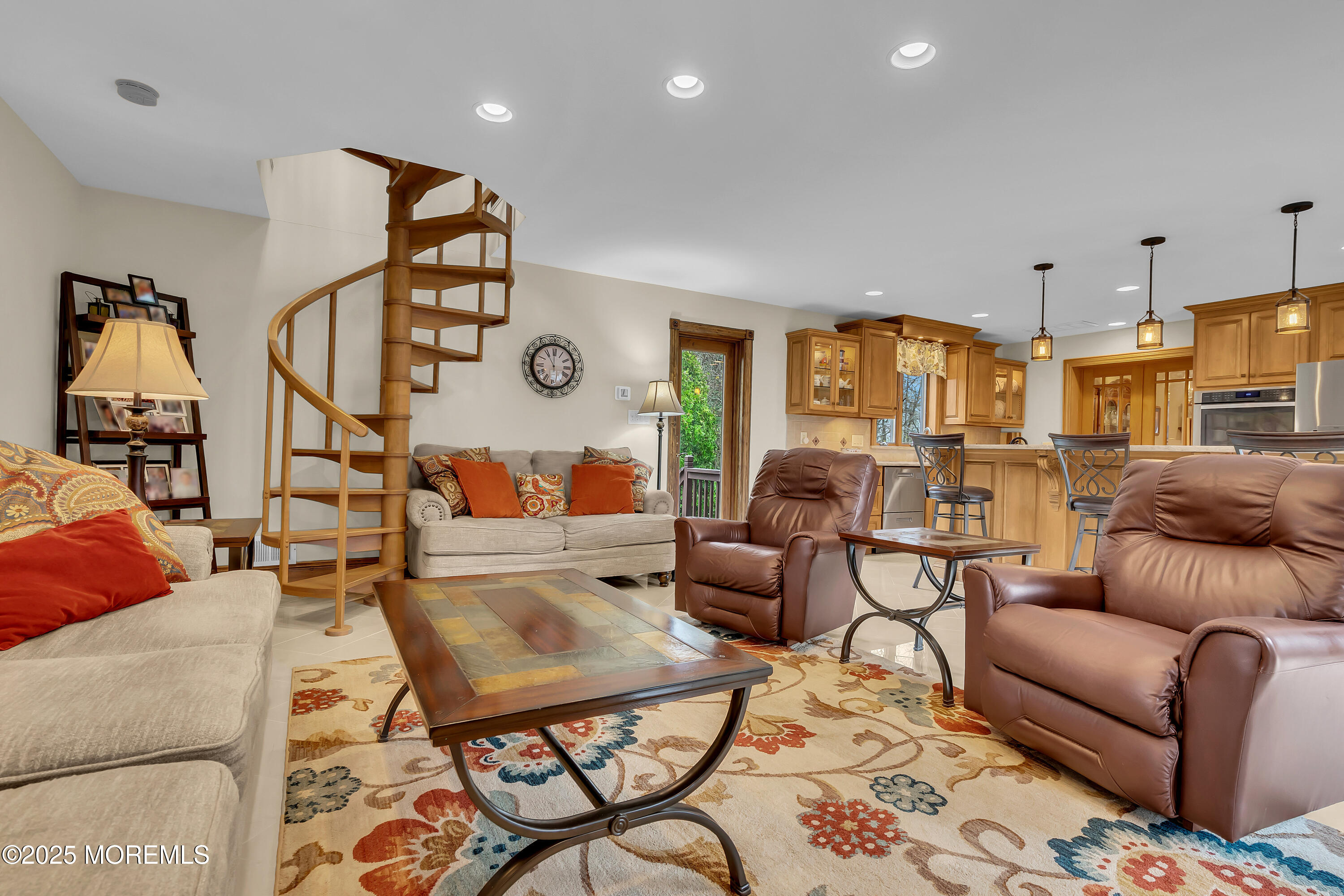 49 Highbridge Road New Egypt, NJ 08533 - Photo 24 of 44 a living room with furniture a rug and a chandelier