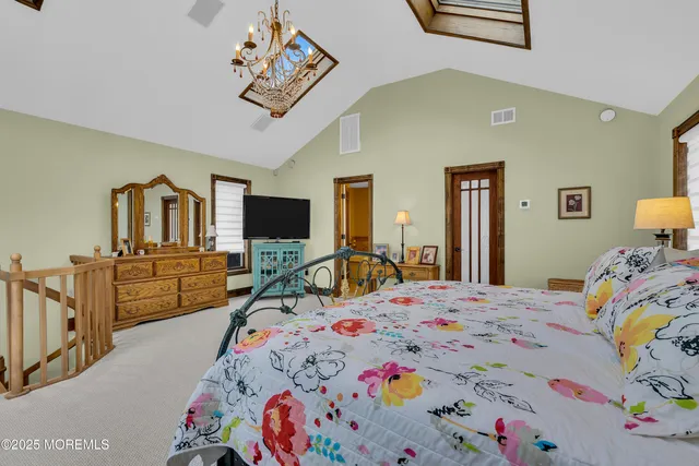 a bed room with a bed and a television