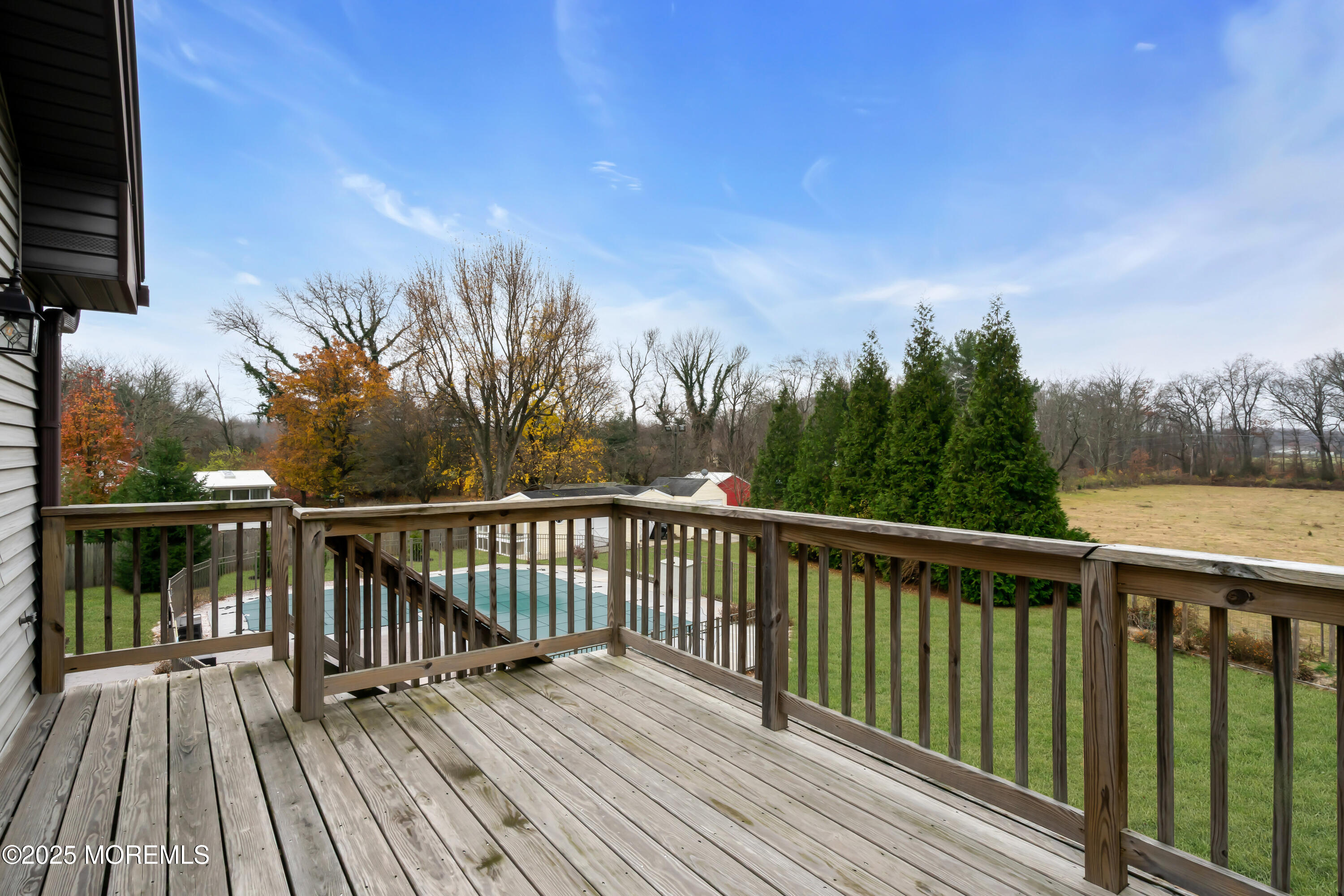 49 Highbridge Road New Egypt, NJ 08533 - Photo 36 of 44 a view of balcony with wooden floor and fence