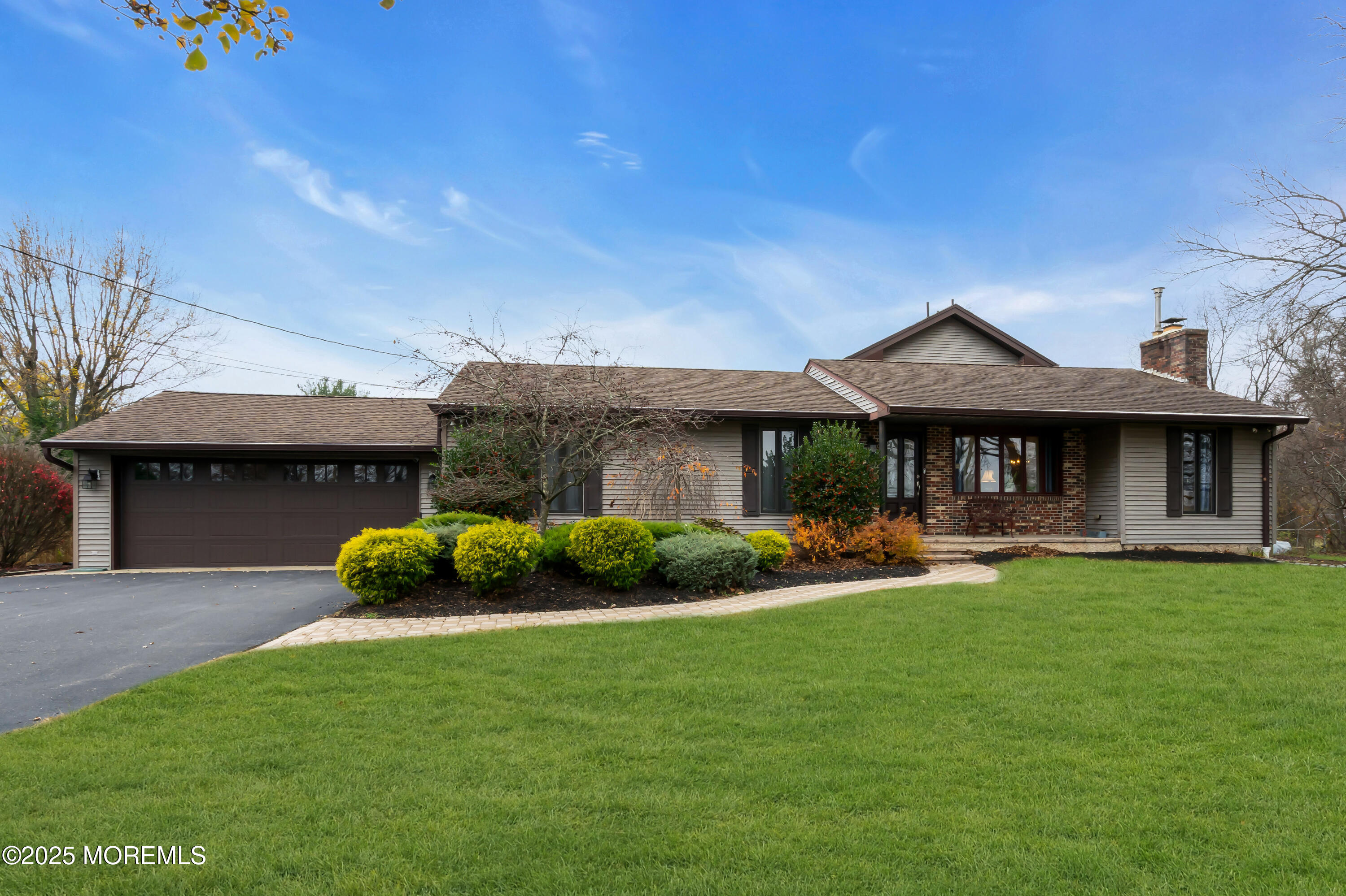 49 Highbridge Road New Egypt, NJ 08533 - Photo 5 of 44 a front view of a house with a garden and sitting area