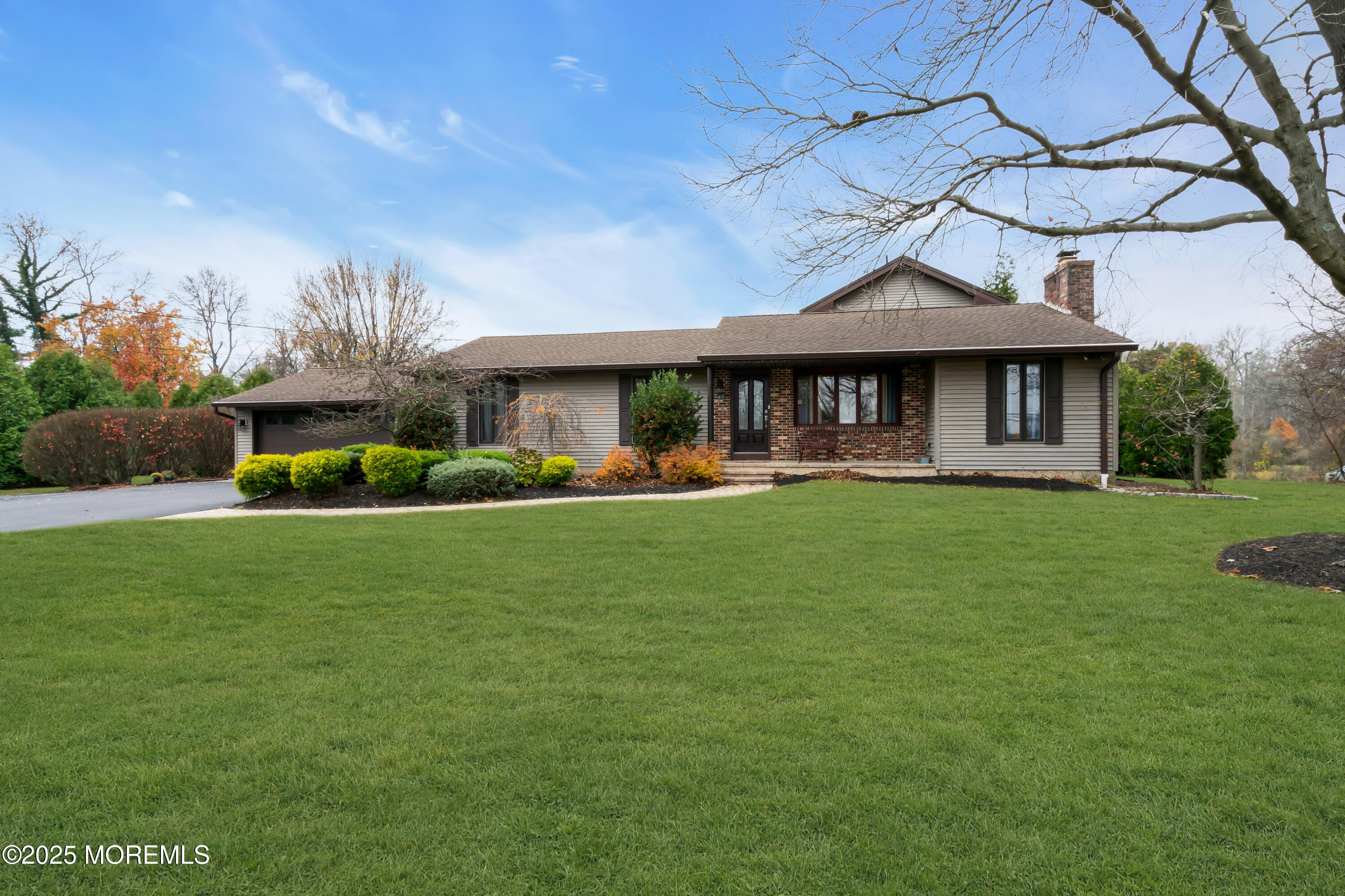 49 Highbridge Road New Egypt, NJ 08533 - Photo 6 of 44 a front view of a house with a yard table and chairs