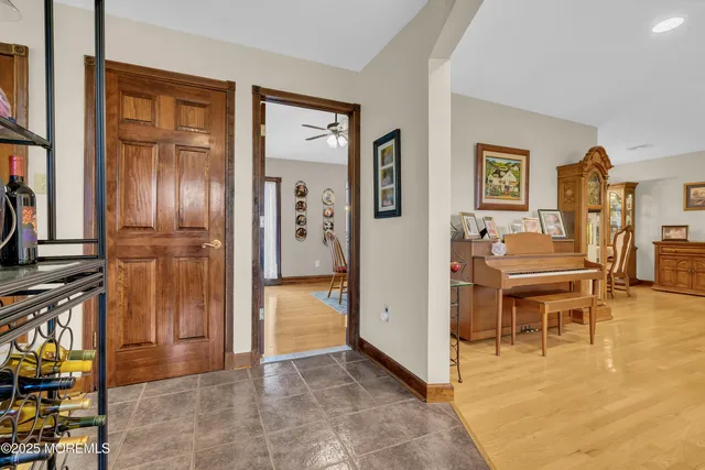a view of kitchen with furniture and refrigerator
