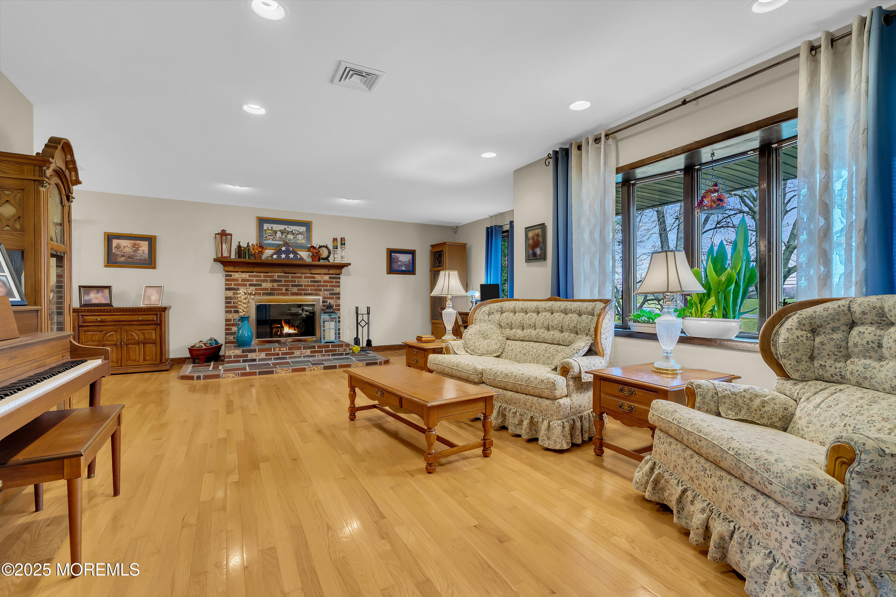 49 Highbridge Road New Egypt, NJ 08533 - Photo 9 of 44 a living room with furniture and a fireplace