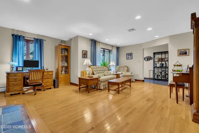 a living room with furniture and a table