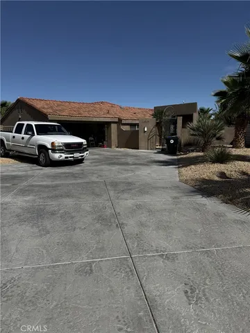 a car parked in parking area of a house