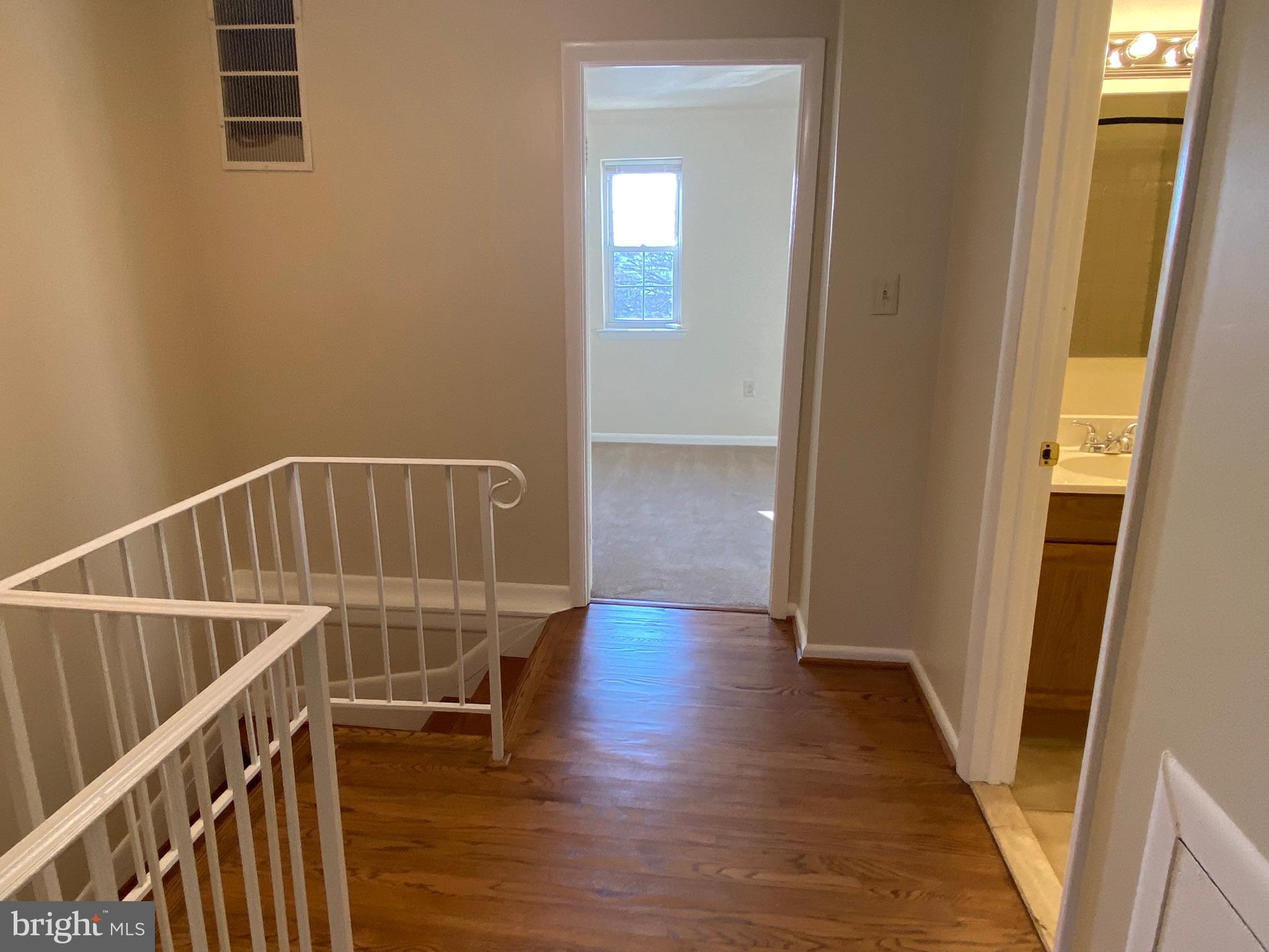 7432 Pohick Road Lorton, VA 22079 - Photo 14 of 27 a view of entryway with wooden floor