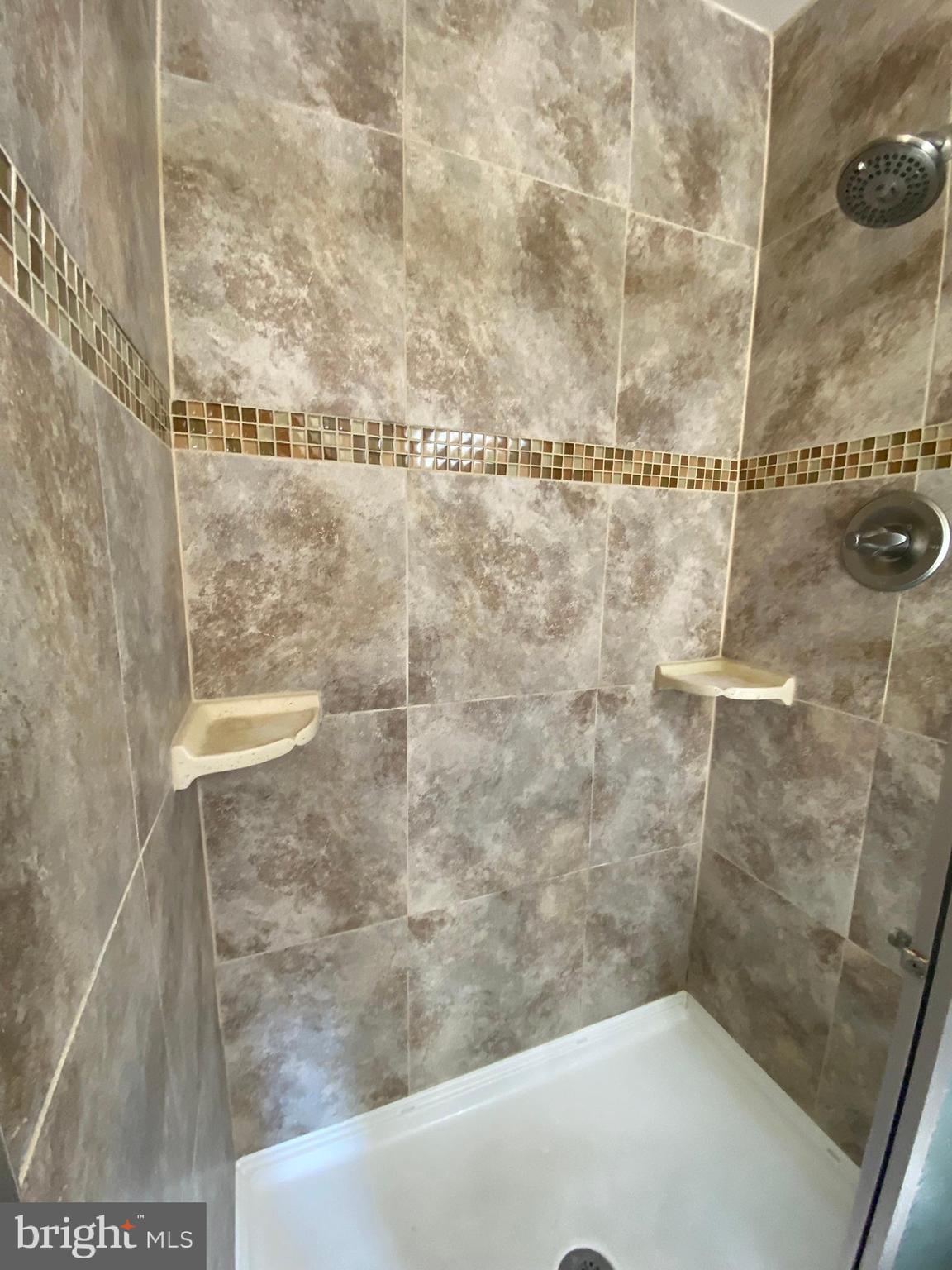 7432 Pohick Road Lorton, VA 22079 - Photo 18 of 27 a bathroom with a shower