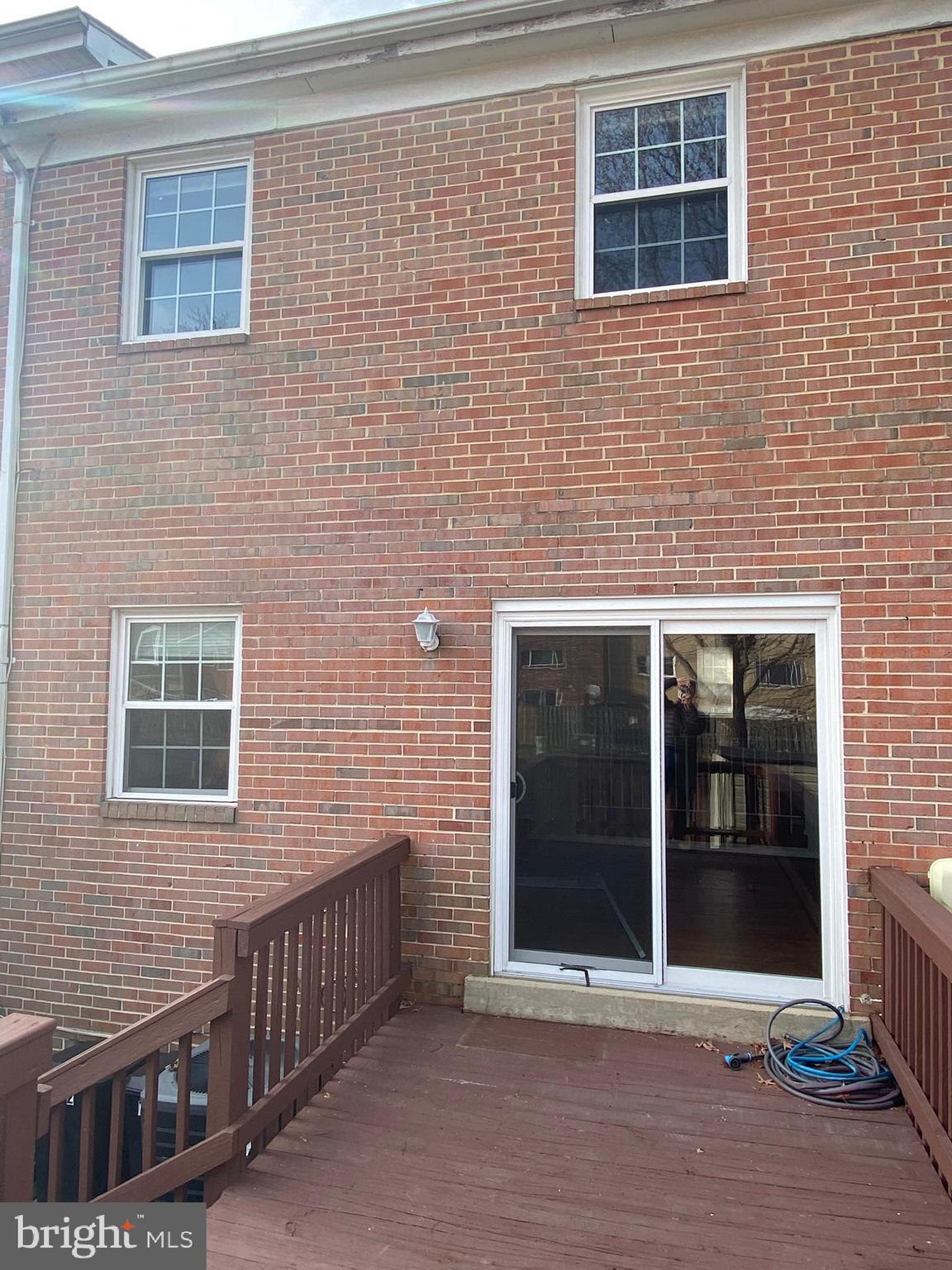7432 Pohick Road Lorton, VA 22079 - Photo 24 of 27 a view of a brick house with a large window