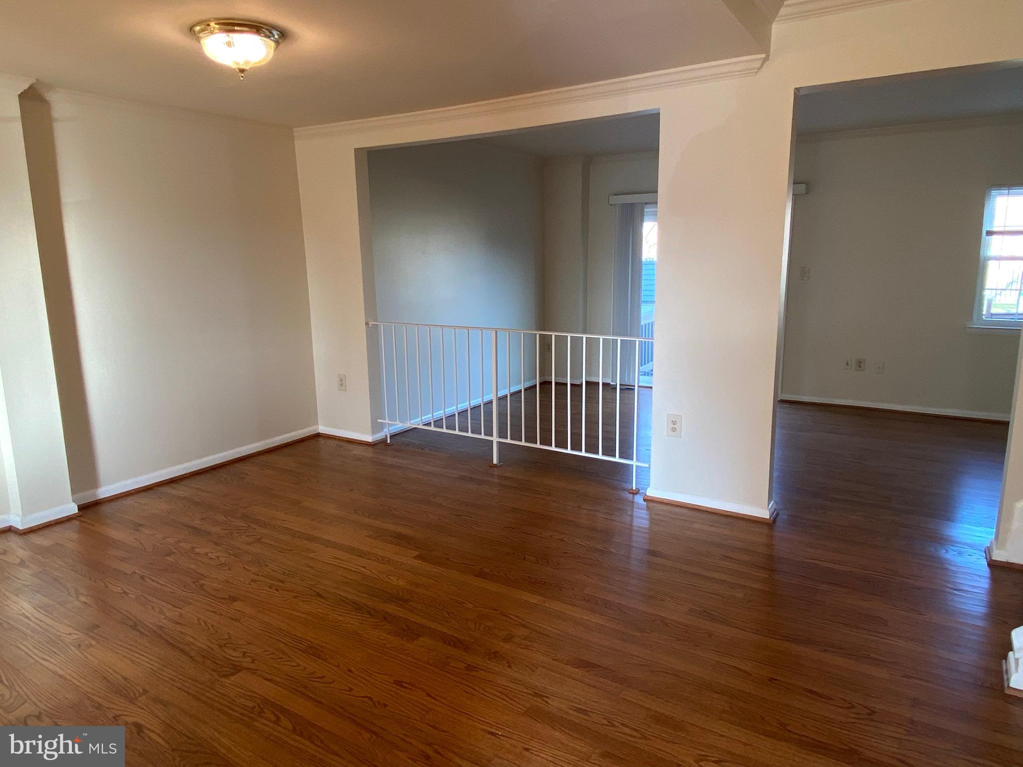 7432 Pohick Road Lorton, VA 22079 - Photo 5 of 27 a view of a hallway with wooden floor