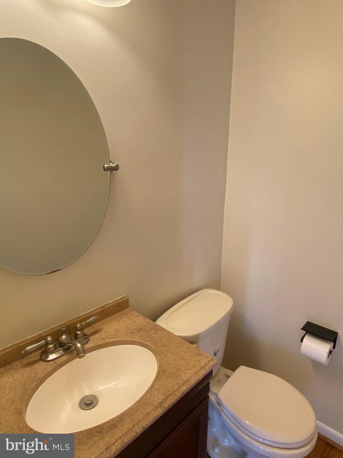 7432 Pohick Road Lorton, VA 22079 - Photo 8 of 27 a bathroom with a sink and a mirror