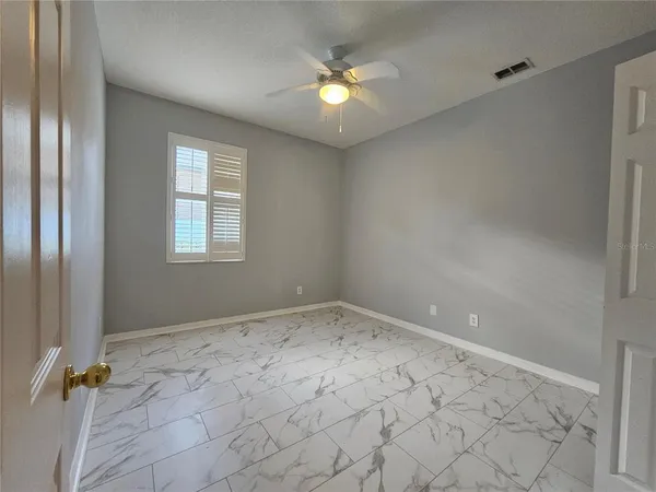 an empty room with windows