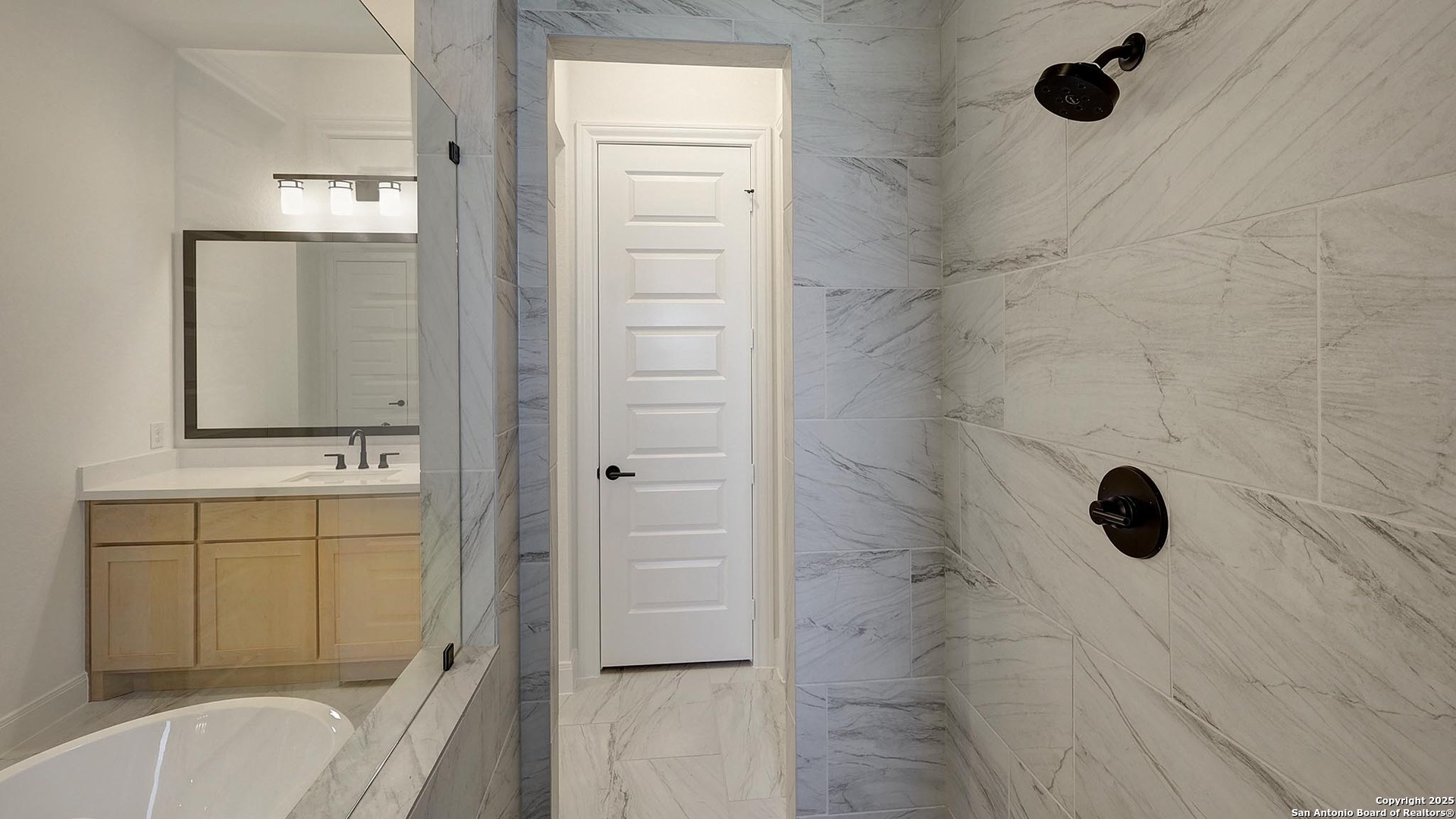 200 Violet Way Castroville, TX 78009 - Photo 15 of 32 a bathroom with a sink a toilet and shower