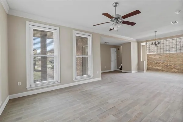 a view of an empty room with a window