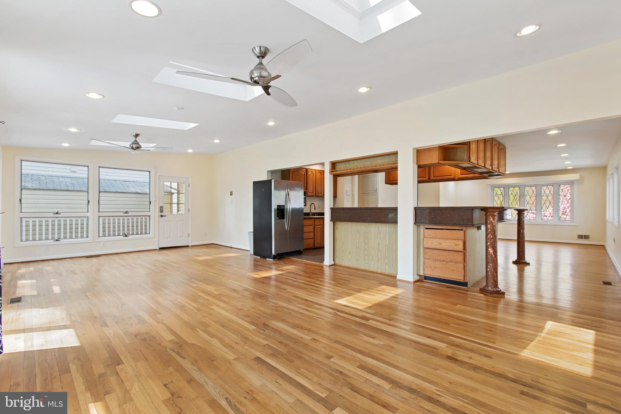 512 Carr Avenue Rockville, MD 20850 - Photo 17 of 56 a view of an empty room with wooden floor and a window