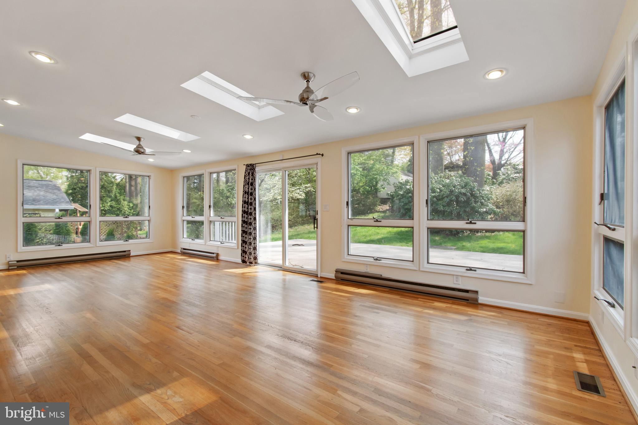 512 Carr Avenue Rockville, MD 20850 - Photo 19 of 56 a view of empty room with wooden floor and fan