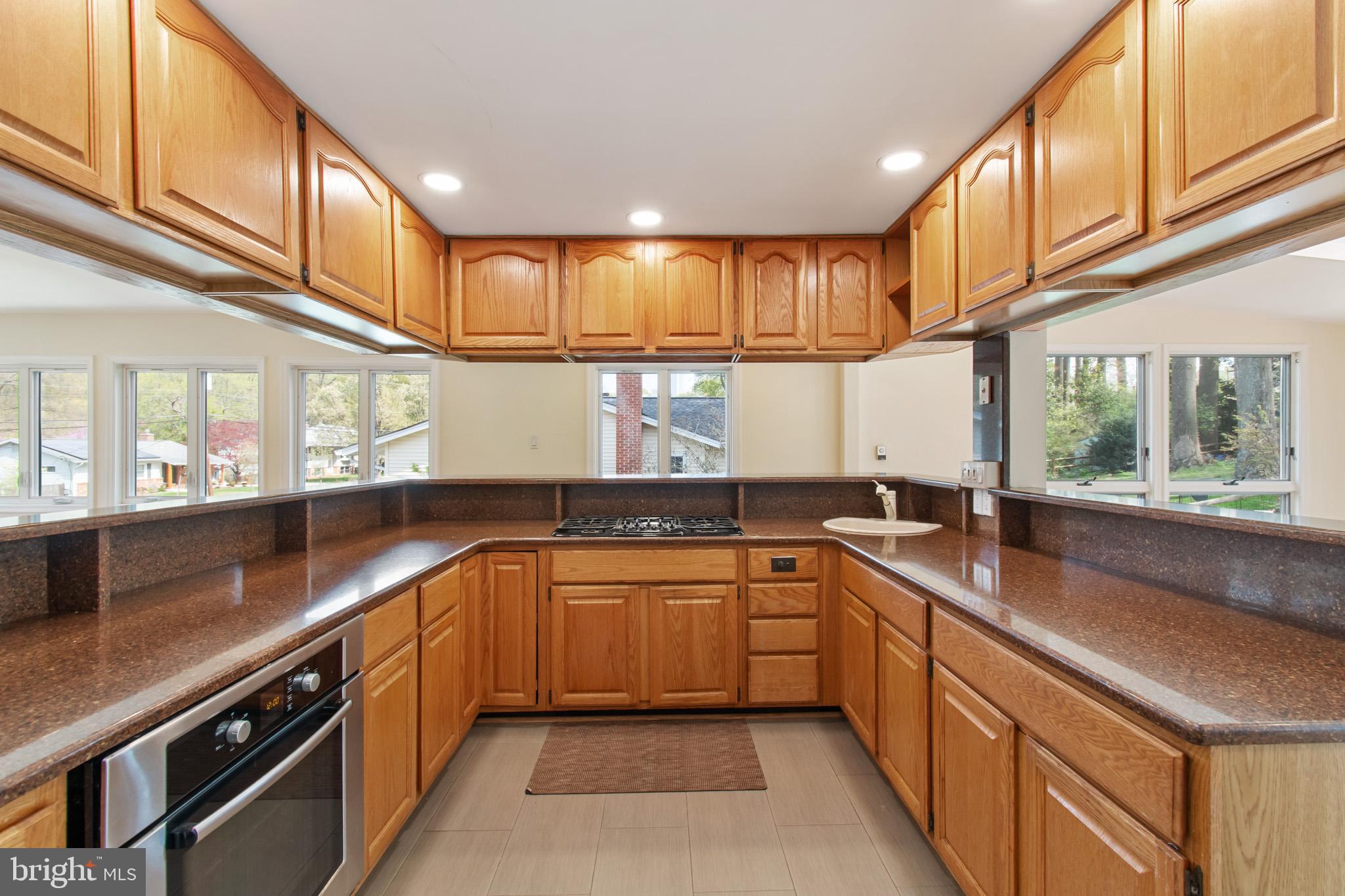 512 Carr Avenue Rockville, MD 20850 - Photo 23 of 56 a kitchen with lots of counter space and windows