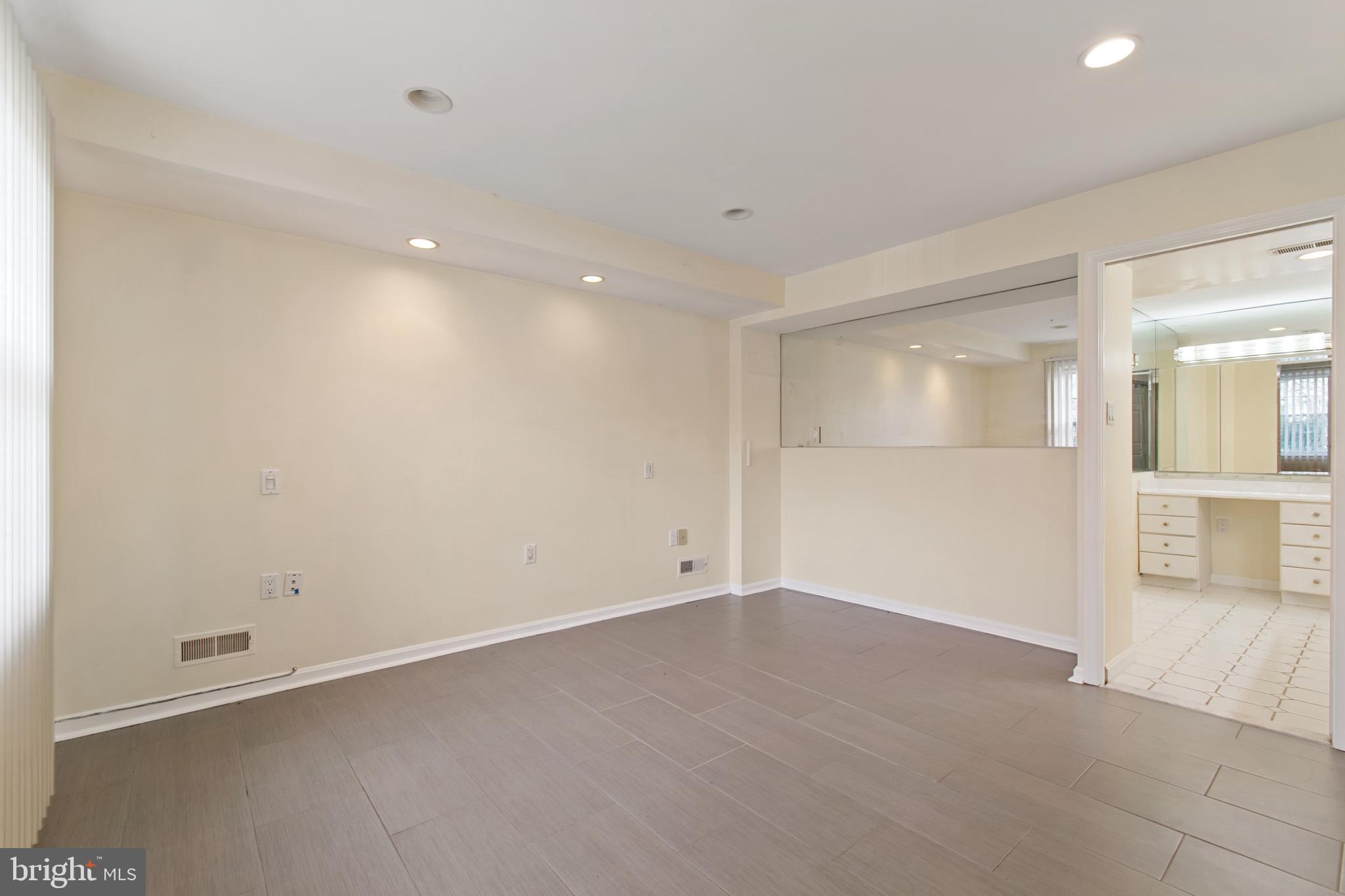 512 Carr Avenue Rockville, MD 20850 - Photo 32 of 56 an empty room with a empty space and mirror