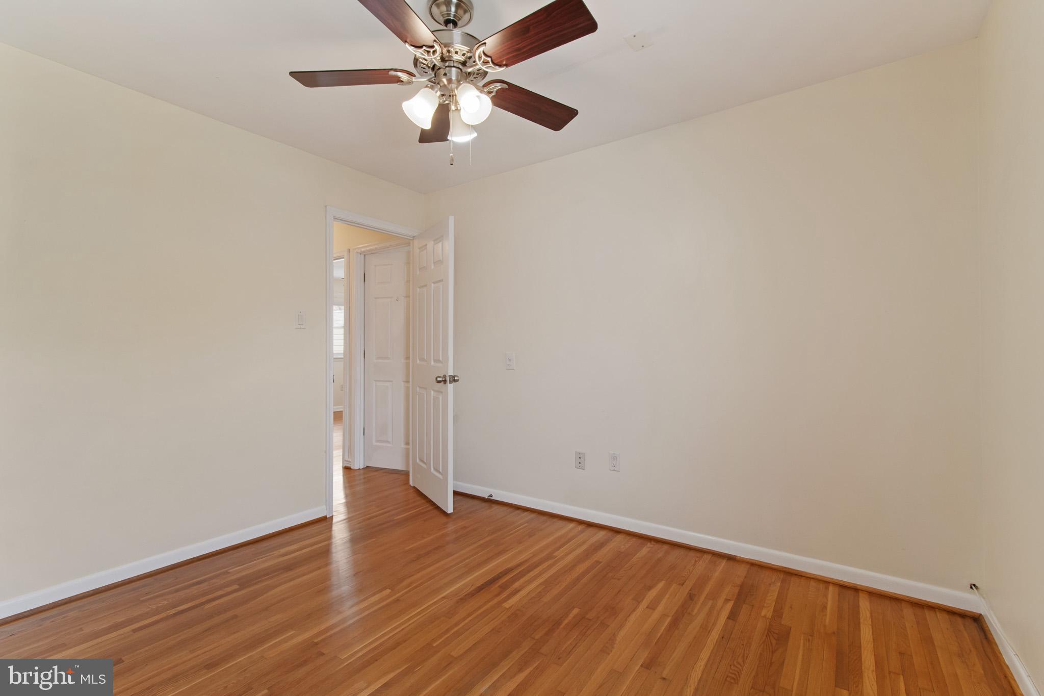 512 Carr Avenue Rockville, MD 20850 - Photo 37 of 56 a view of an empty room with wooden floor