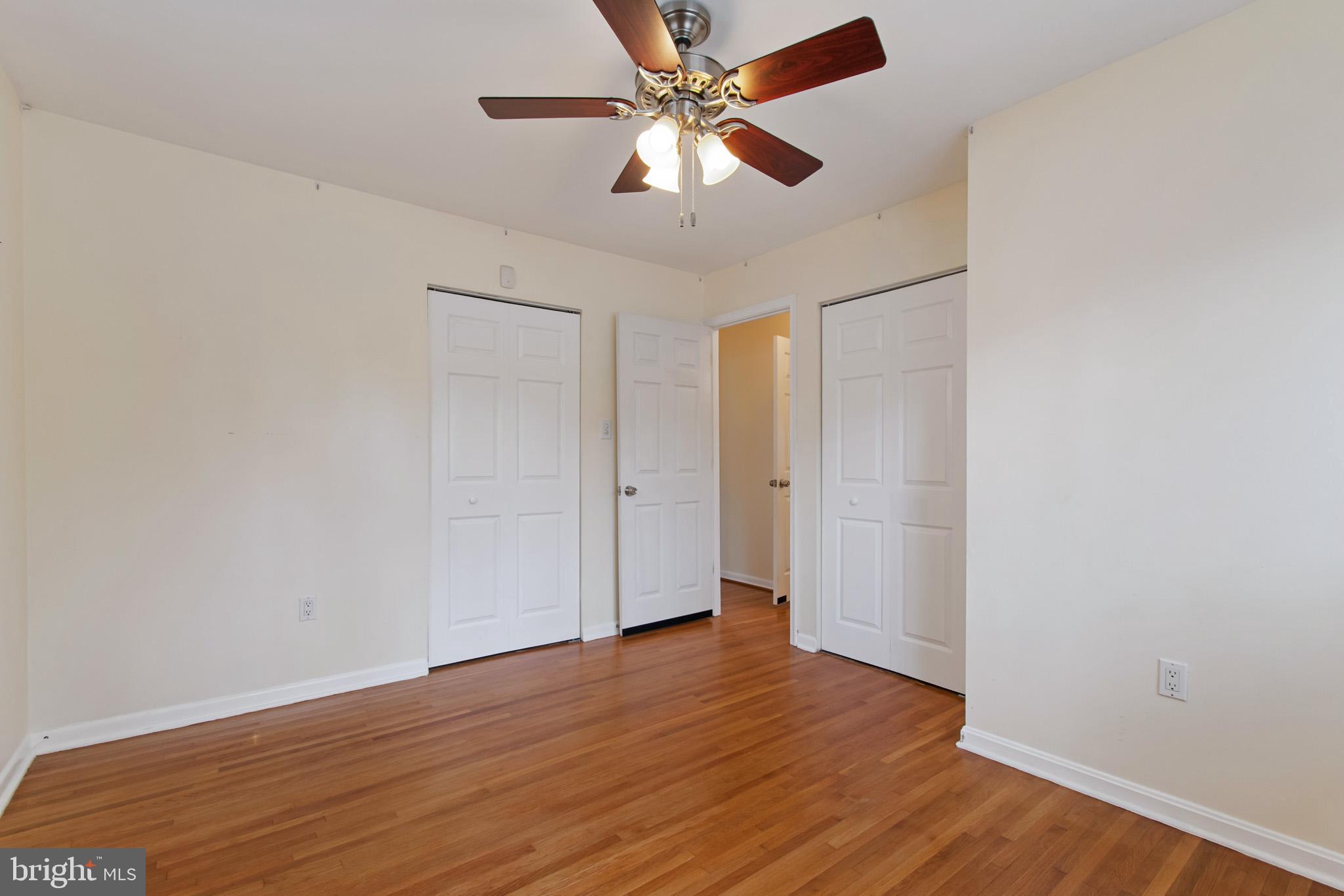 512 Carr Avenue Rockville, MD 20850 - Photo 39 of 56 a view of a room with wooden floor and a ceiling fan