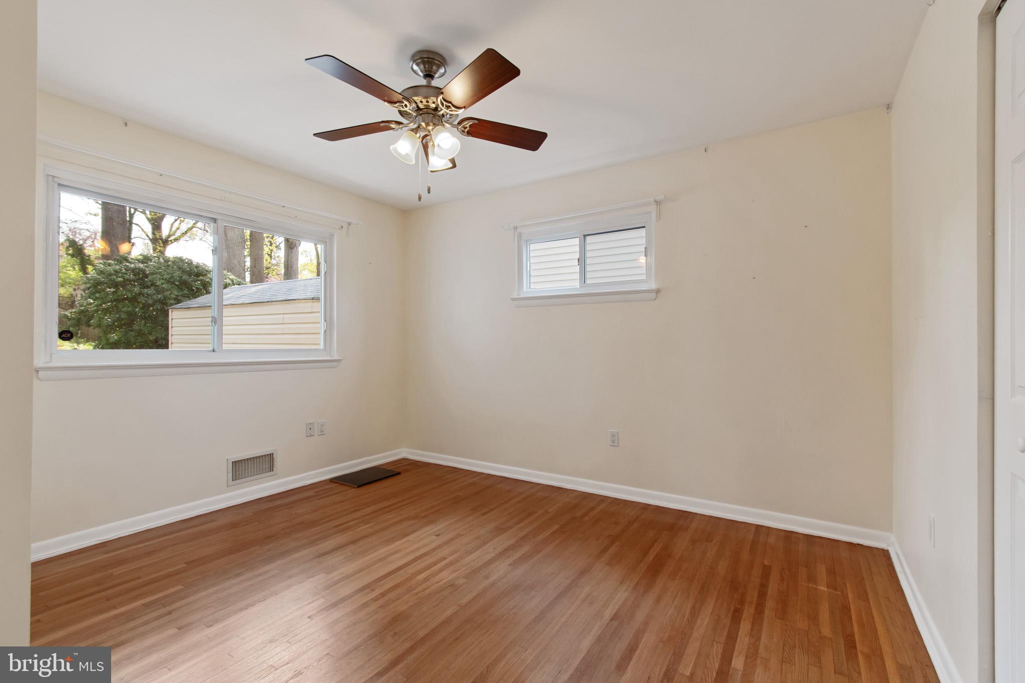 512 Carr Avenue Rockville, MD 20850 - Photo 40 of 56 a view of a big room with wooden floor and windows