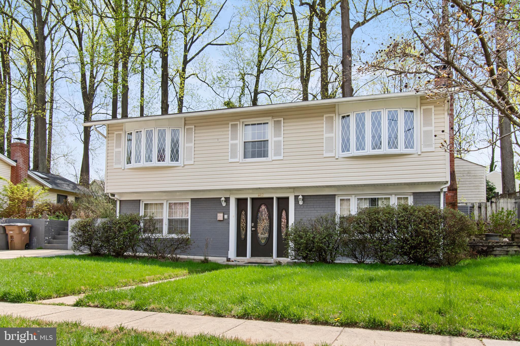 512 Carr Avenue Rockville, MD 20850 - Photo 4 of 56 a view of a house with a yard and plants