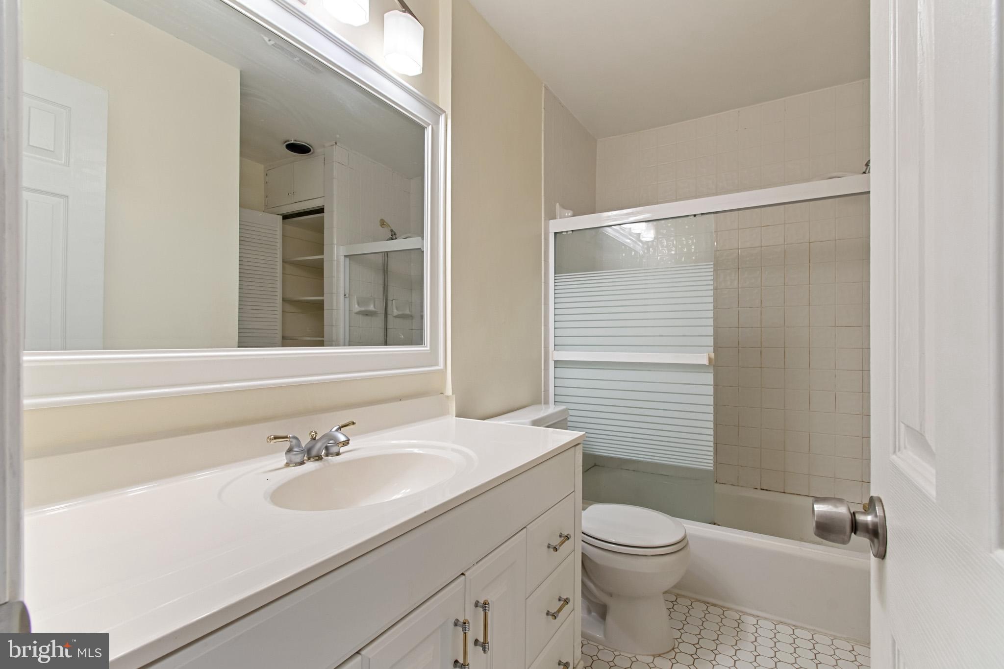 512 Carr Avenue Rockville, MD 20850 - Photo 42 of 56 a bathroom with a sink toilet and shower