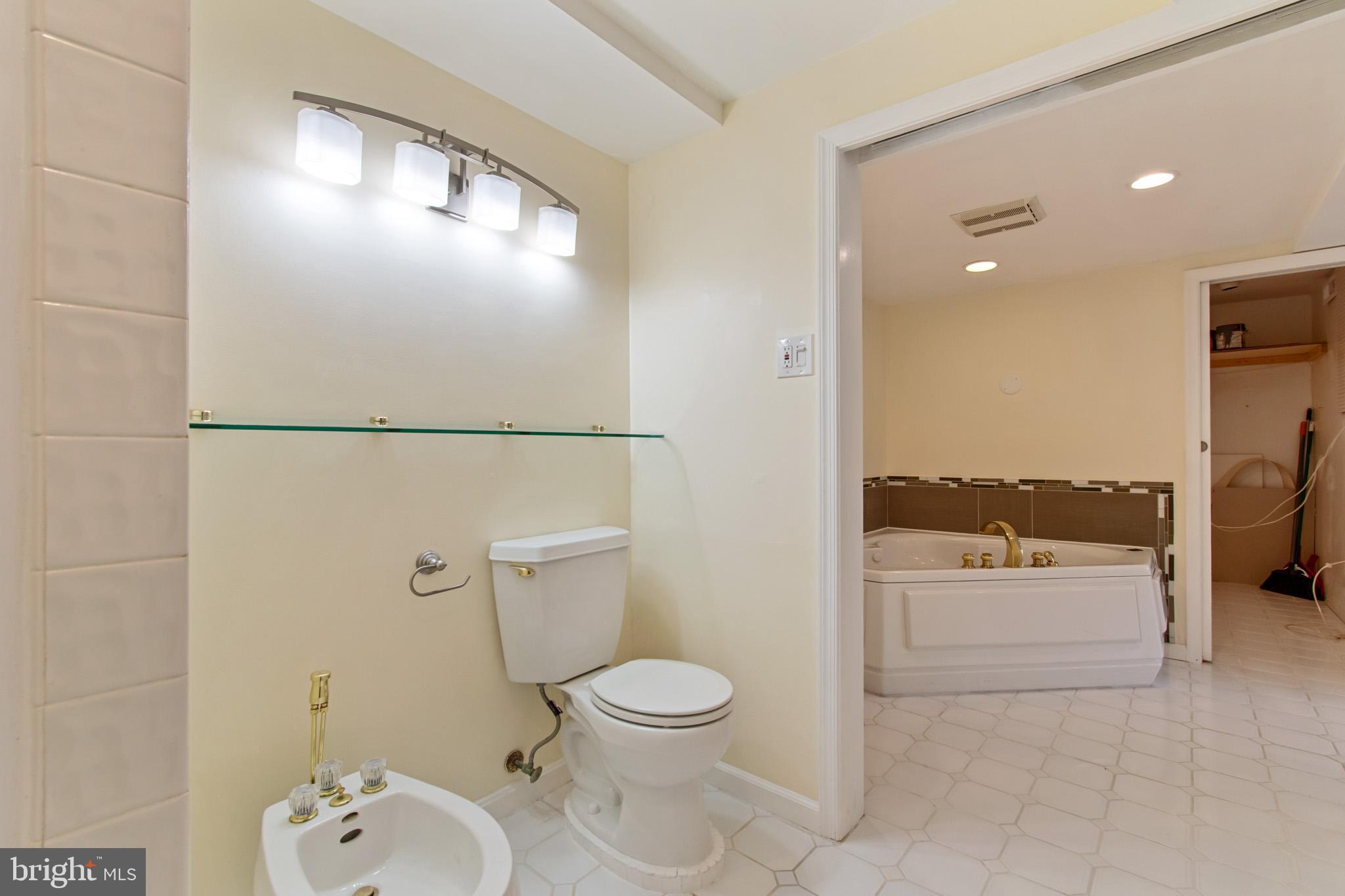 512 Carr Avenue Rockville, MD 20850 - Photo 47 of 56 a bathroom with a toilet a sink and a shower