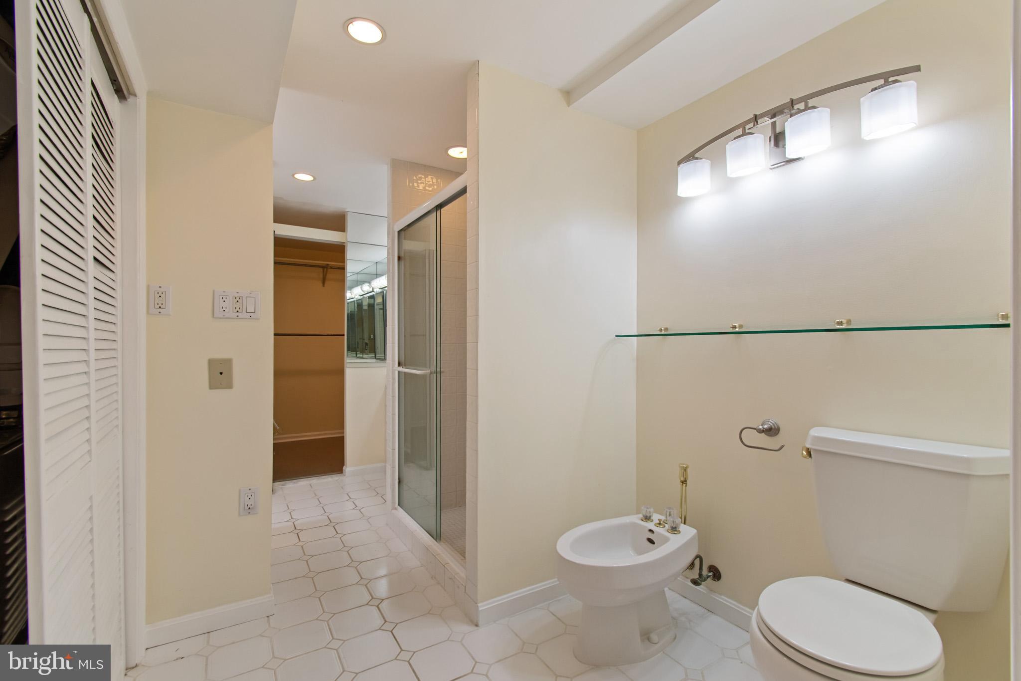 512 Carr Avenue Rockville, MD 20850 - Photo 49 of 56 a bathroom with a toilet a sink and mirror