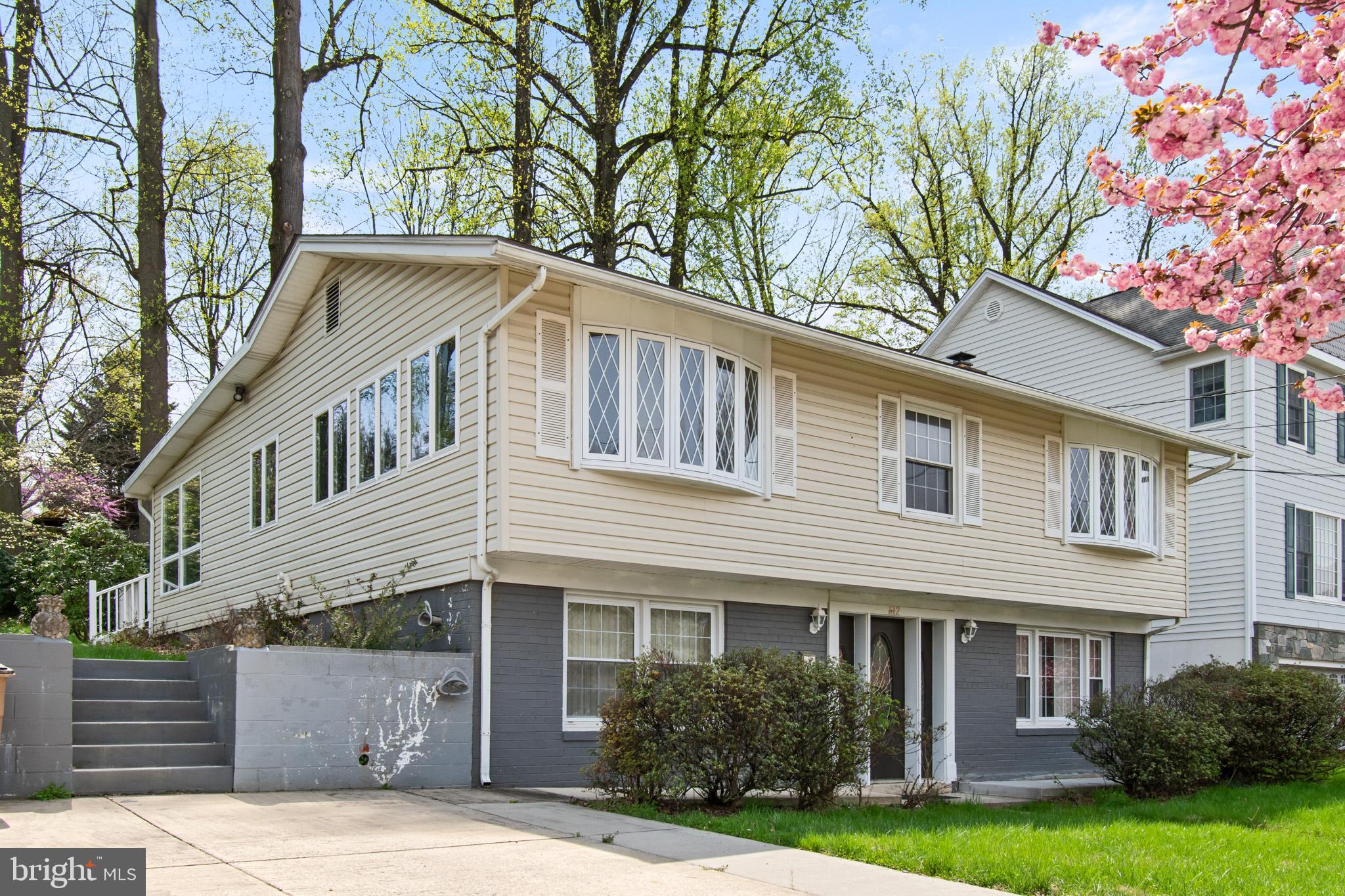 512 Carr Avenue Rockville, MD 20850 - Photo 5 of 56 a front view of a house with garden