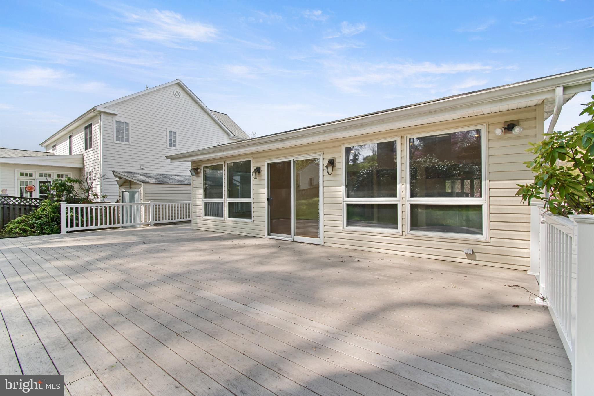 512 Carr Avenue Rockville, MD 20850 - Photo 10 of 56 a view of backyard with large windows and plants