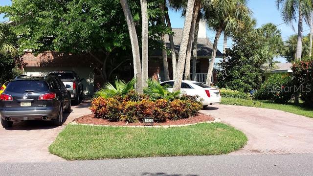 7425 Astor Drive New Port Richey, FL 34652 - Photo 1 of 1 a view of a back yard of the house and cars parked