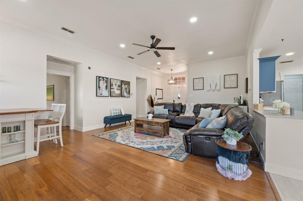 305 Maverick Trail Oak Point, TX 75068 - Photo 11 of 40 a living room with furniture and a wooden floor