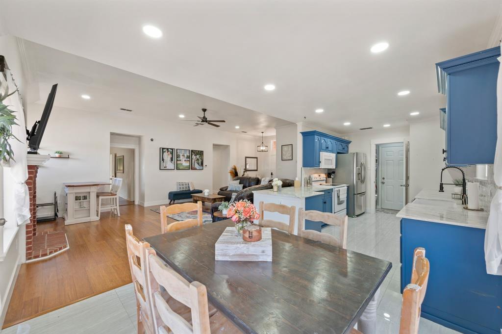 305 Maverick Trail Oak Point, TX 75068 - Photo 13 of 40 a living room with stainless steel appliances furniture dining table and chairs