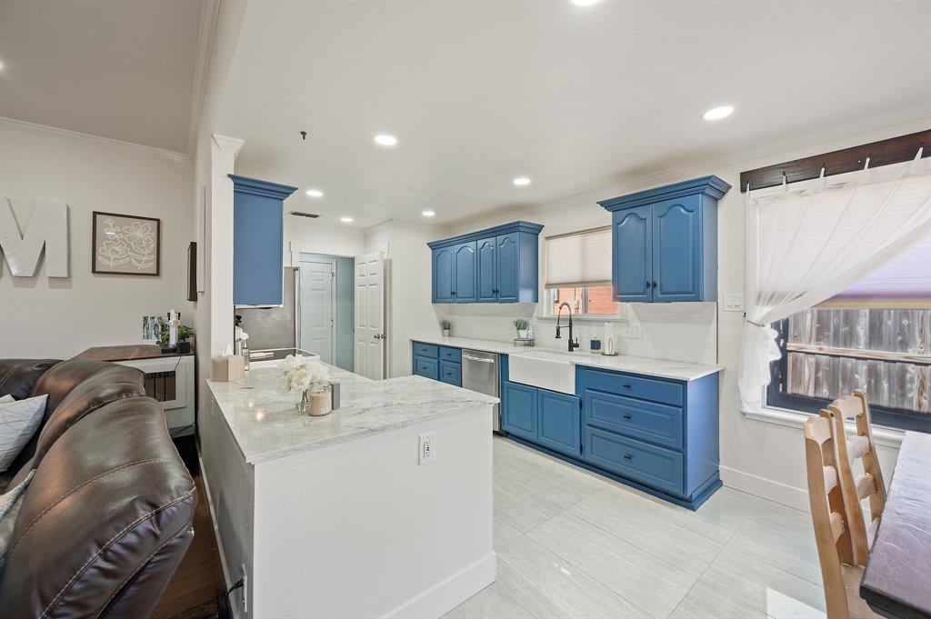 305 Maverick Trail Oak Point, TX 75068 - Photo 14 of 40 a kitchen with a sink stove and cabinets