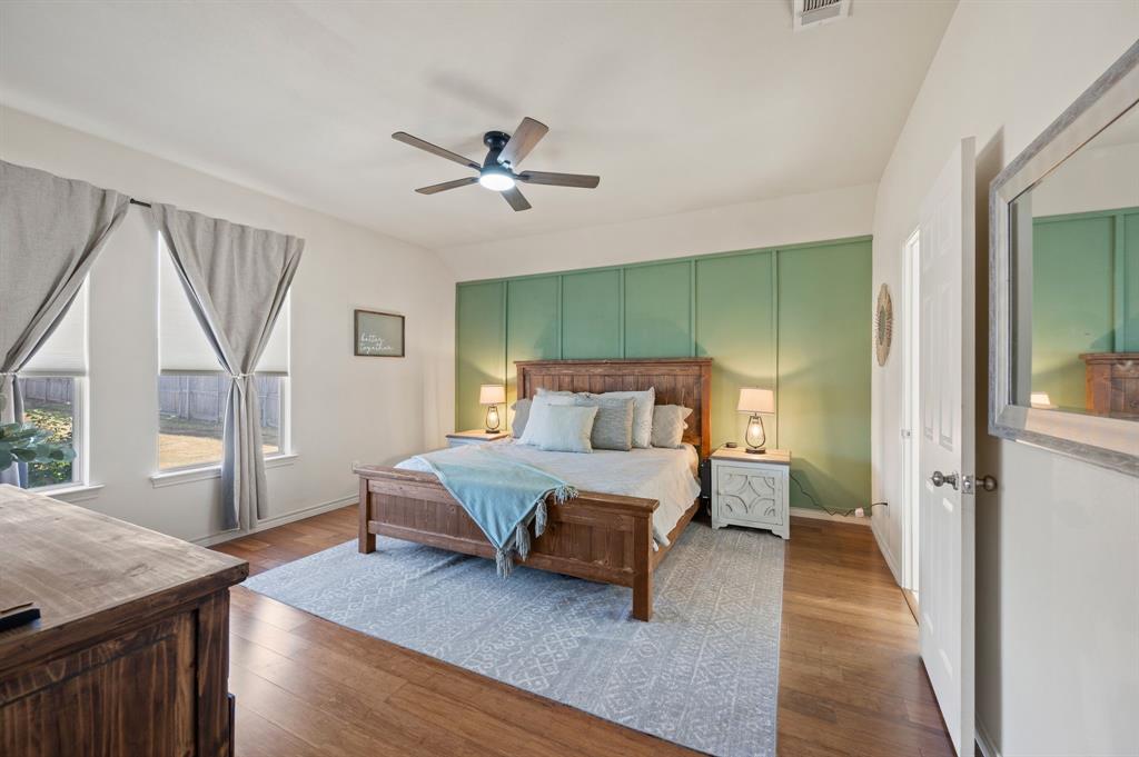 305 Maverick Trail Oak Point, TX 75068 - Photo 21 of 40 a spacious bedroom with a bed and a window