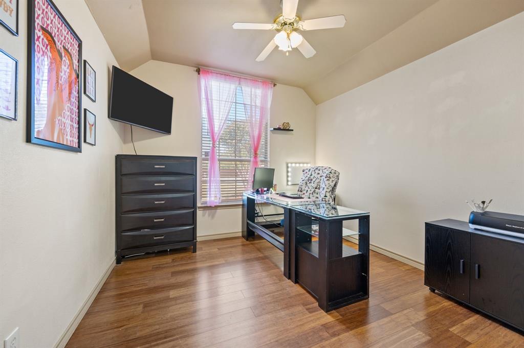 305 Maverick Trail Oak Point, TX 75068 - Photo 26 of 40 a living room with furniture and a flat screen tv