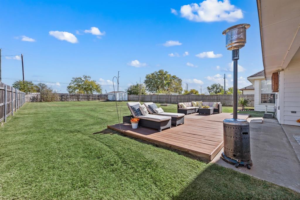 305 Maverick Trail Oak Point, TX 75068 - Photo 32 of 40 a view of a backyard with sitting area